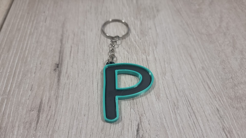 Letters for keychains with raised edge