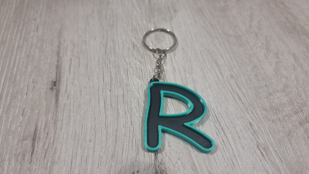Letters for keychains with raised edge