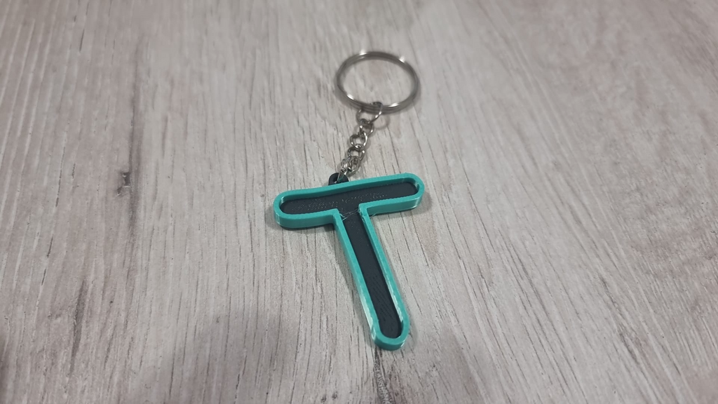 Letters for keychains with raised edge