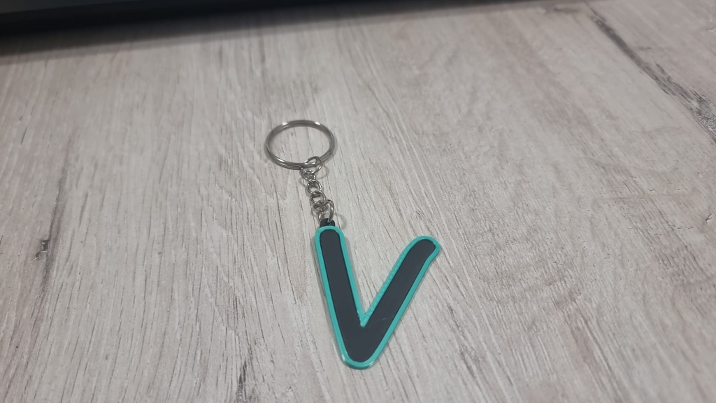 Letters for keychains with raised edge