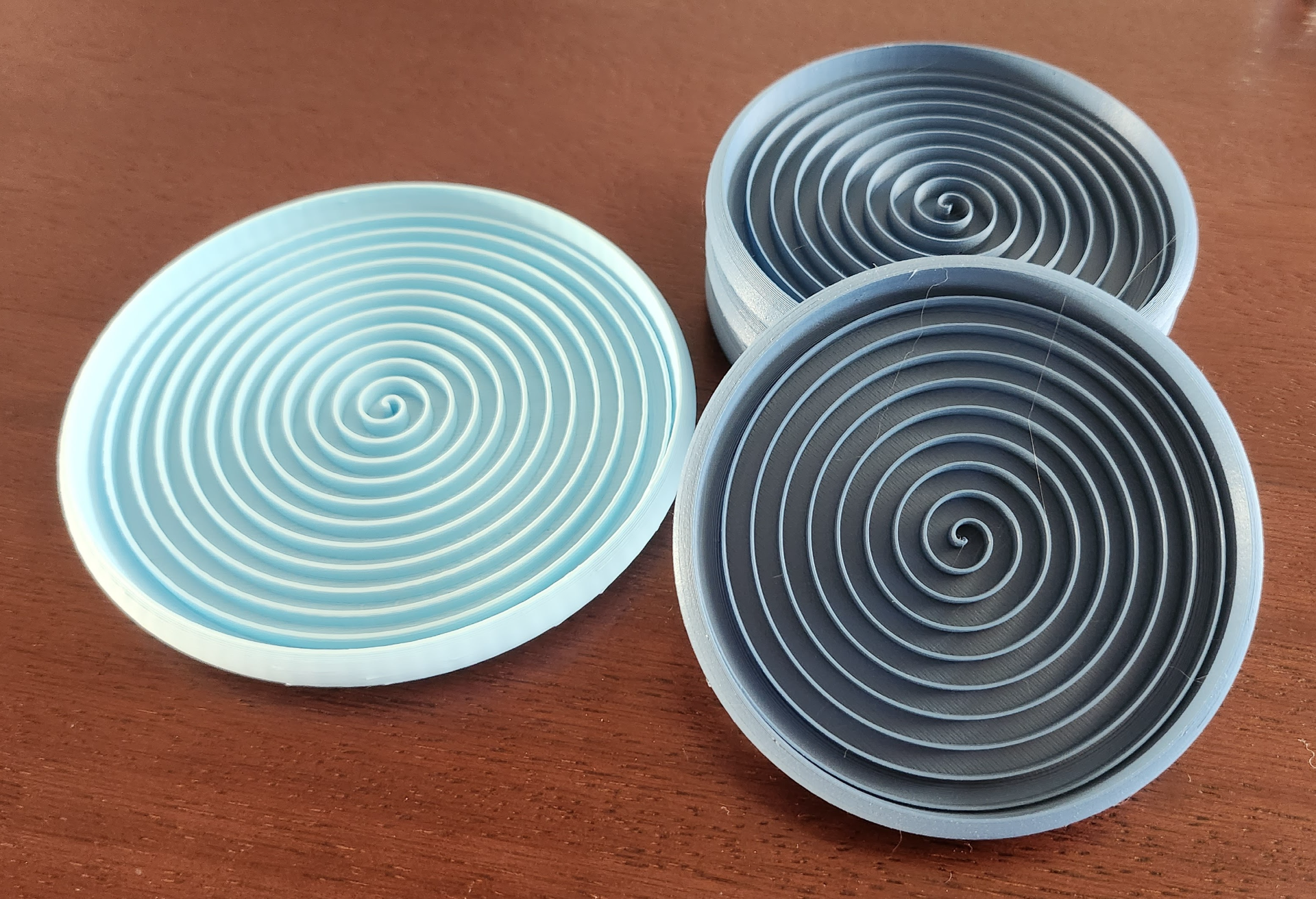 Stackable spiral coasters for glasses
