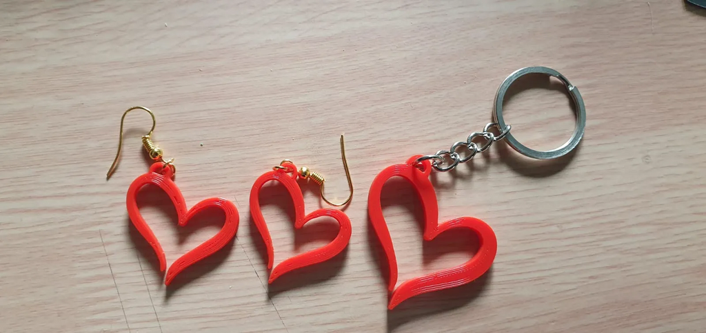 Earrings and keychain in the shape of a heart