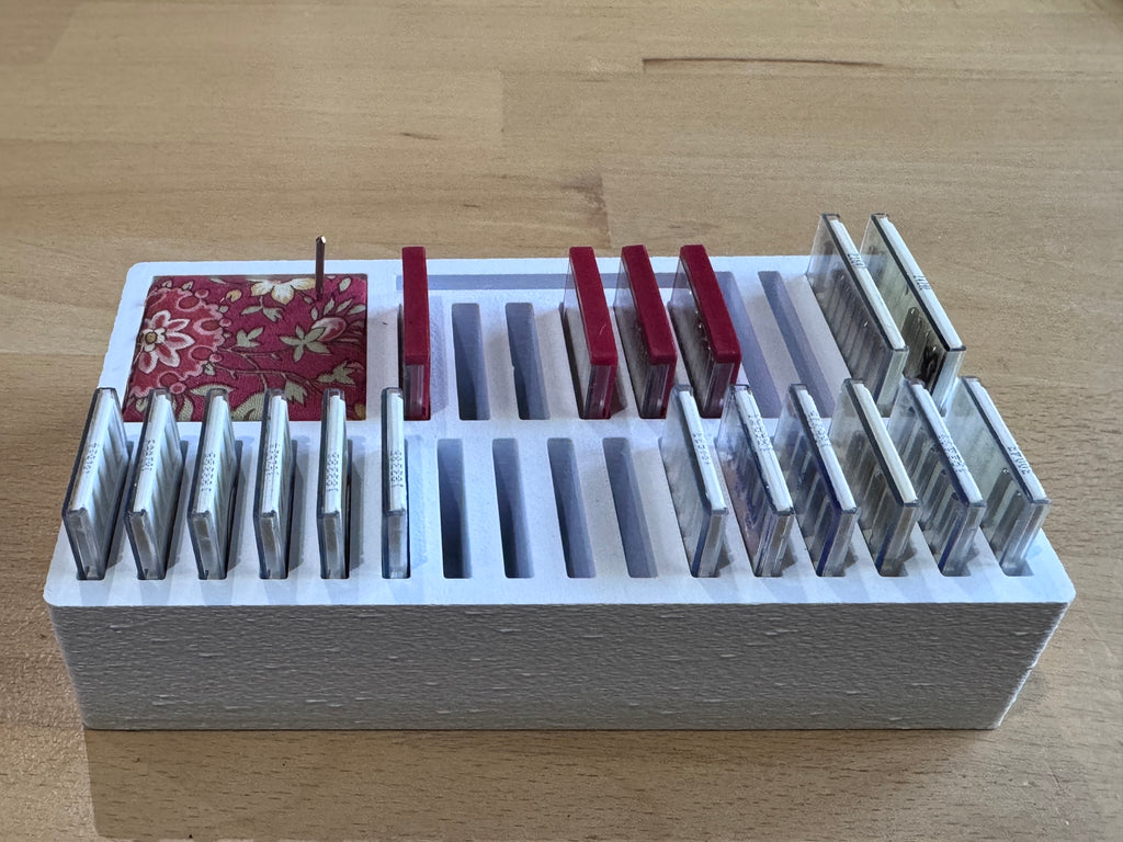 Sewing machine needle box