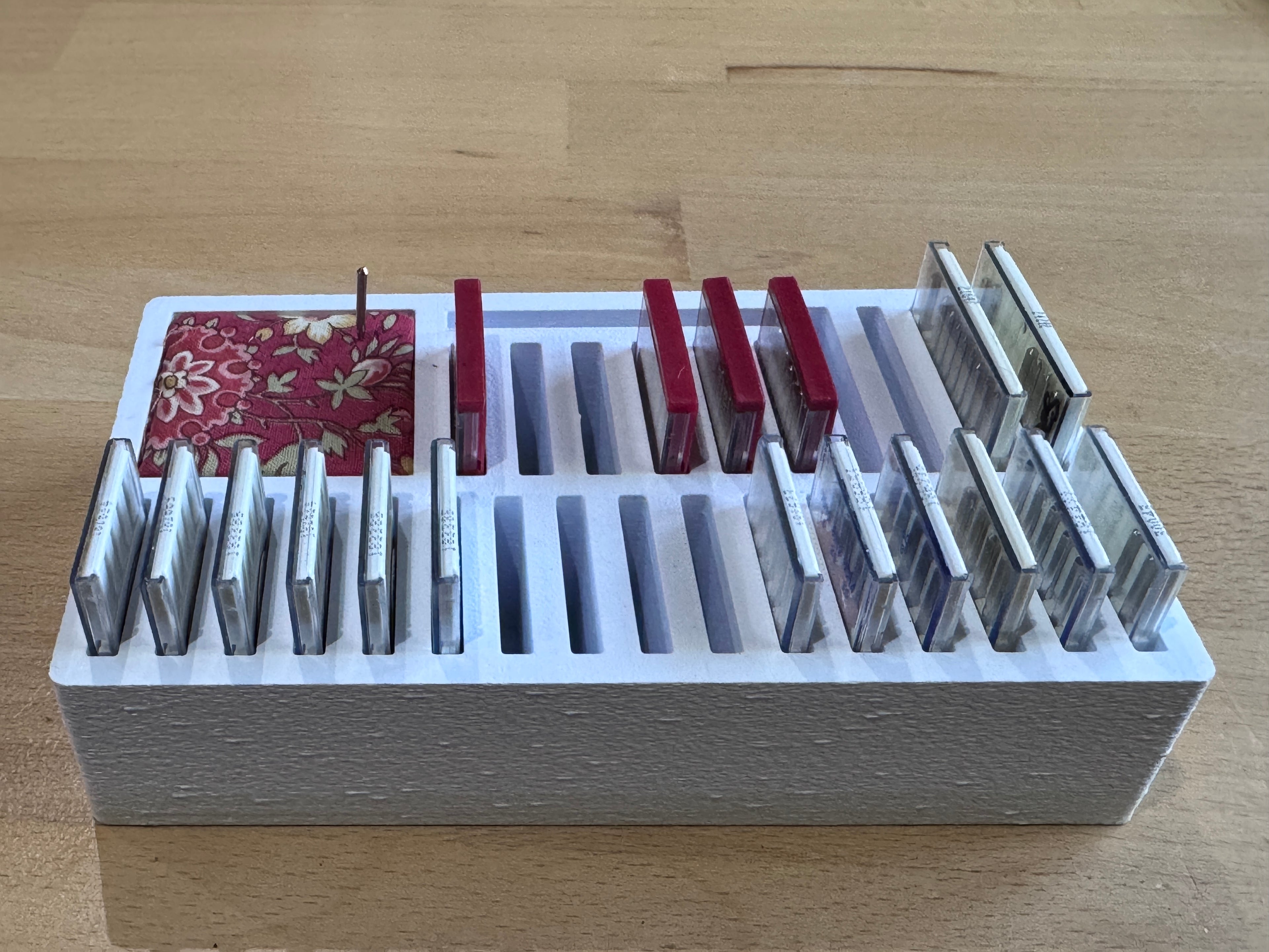 Sewing machine needle box