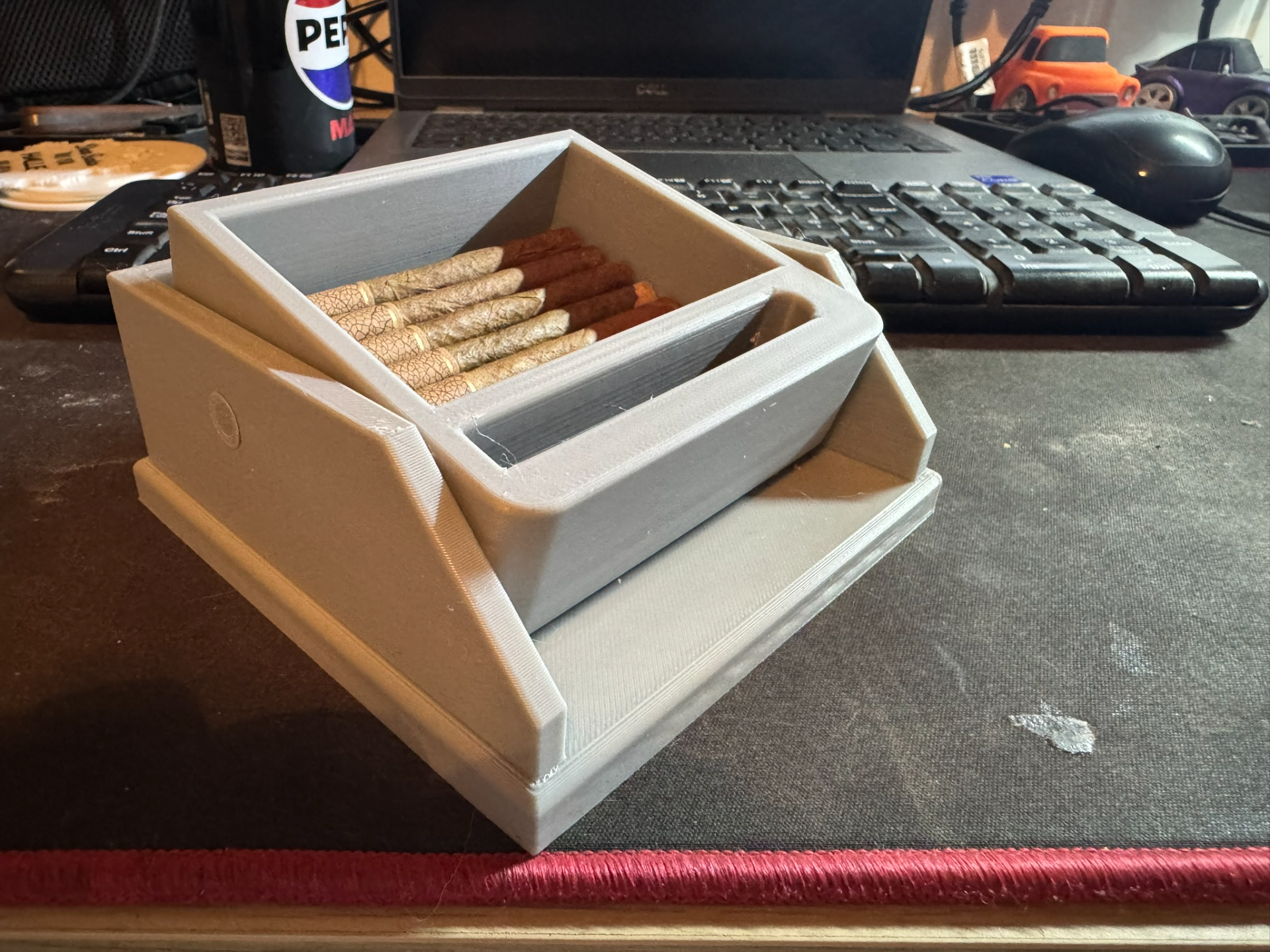 Cigarette box with lift feature