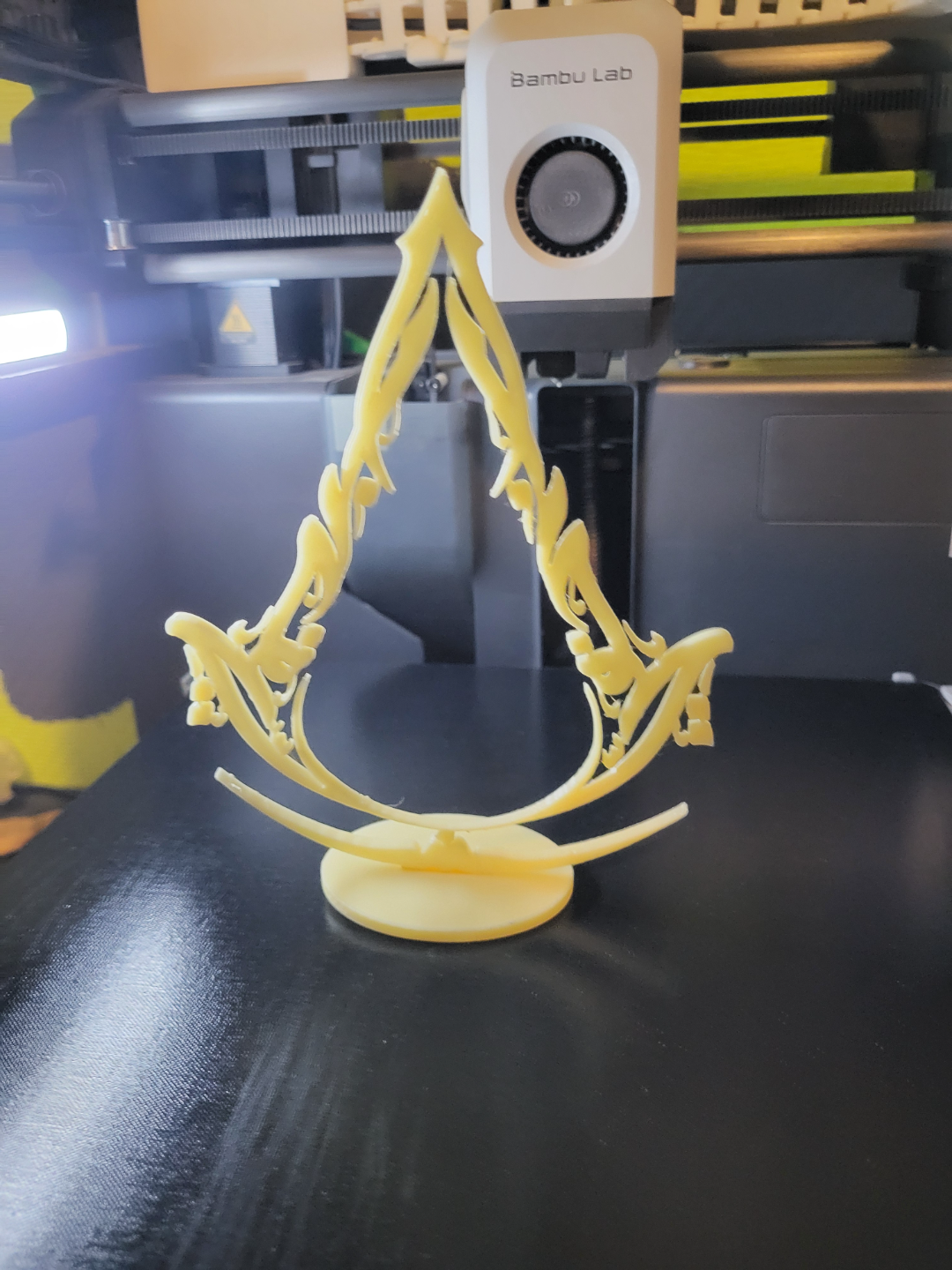 assassin's creed mirage logo and stand