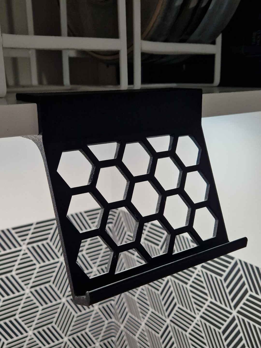 Under cabinet phone stand