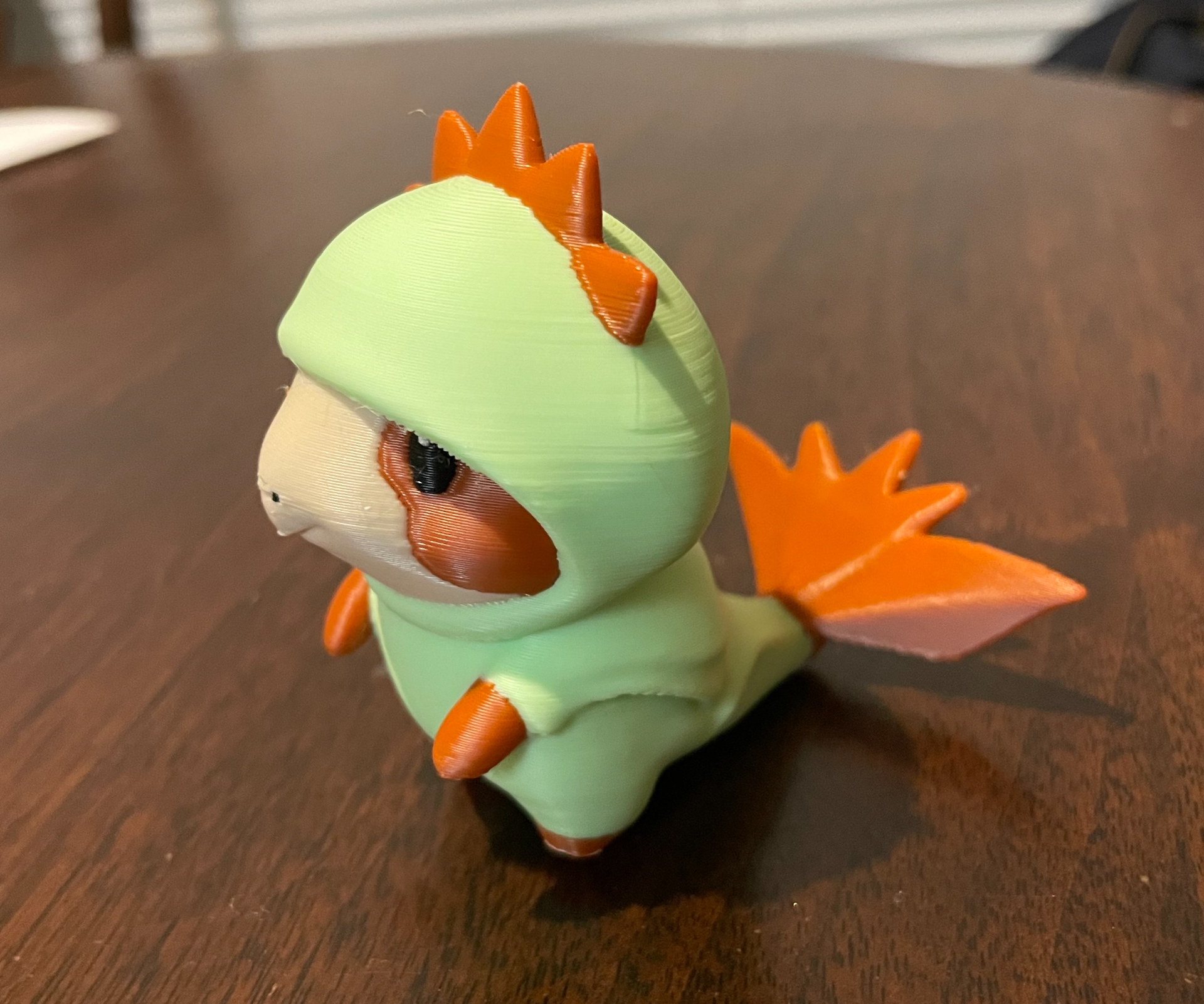 Guinea pig in a dragon onesie