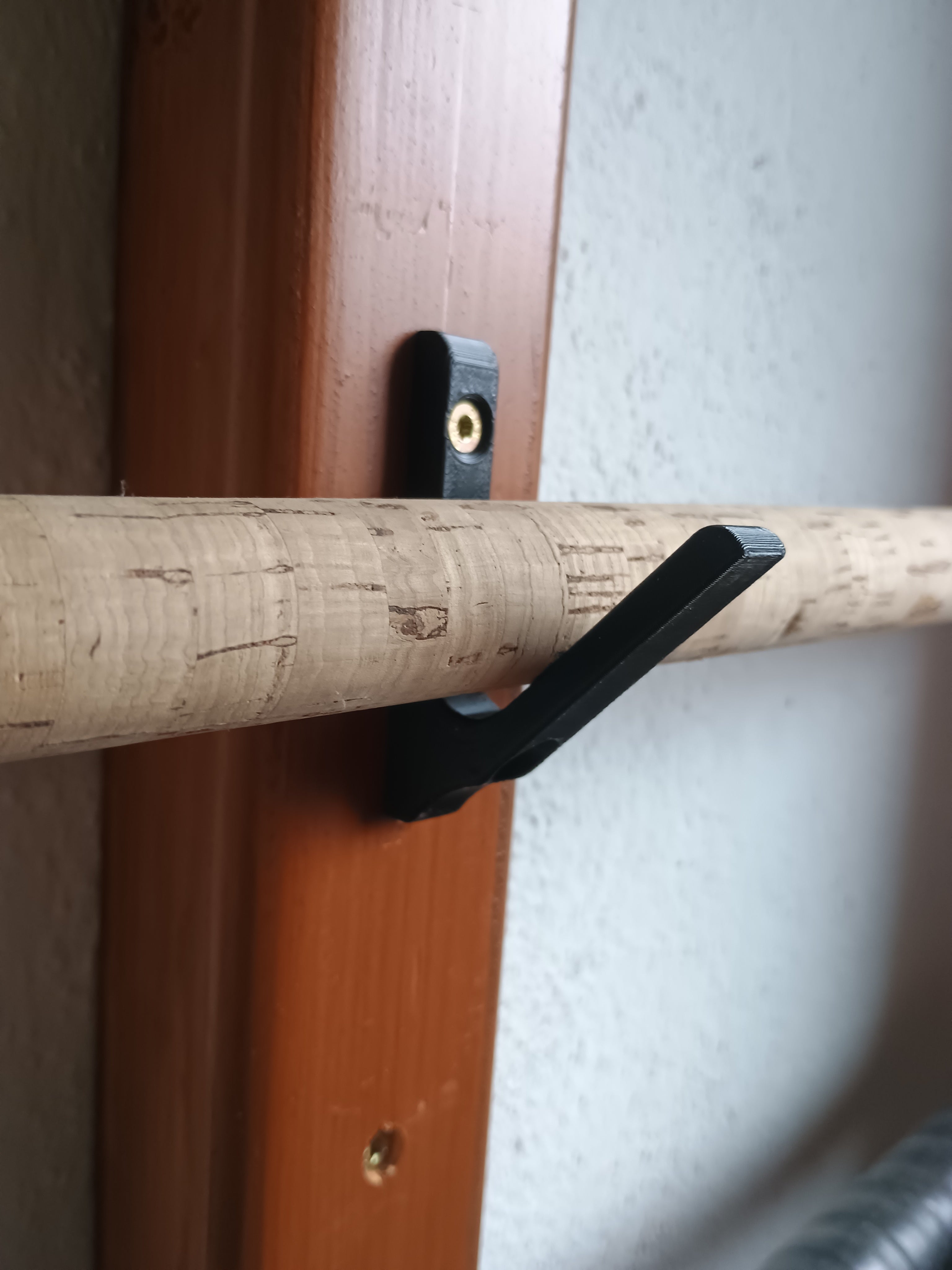 Universal fishing rod holder / hook