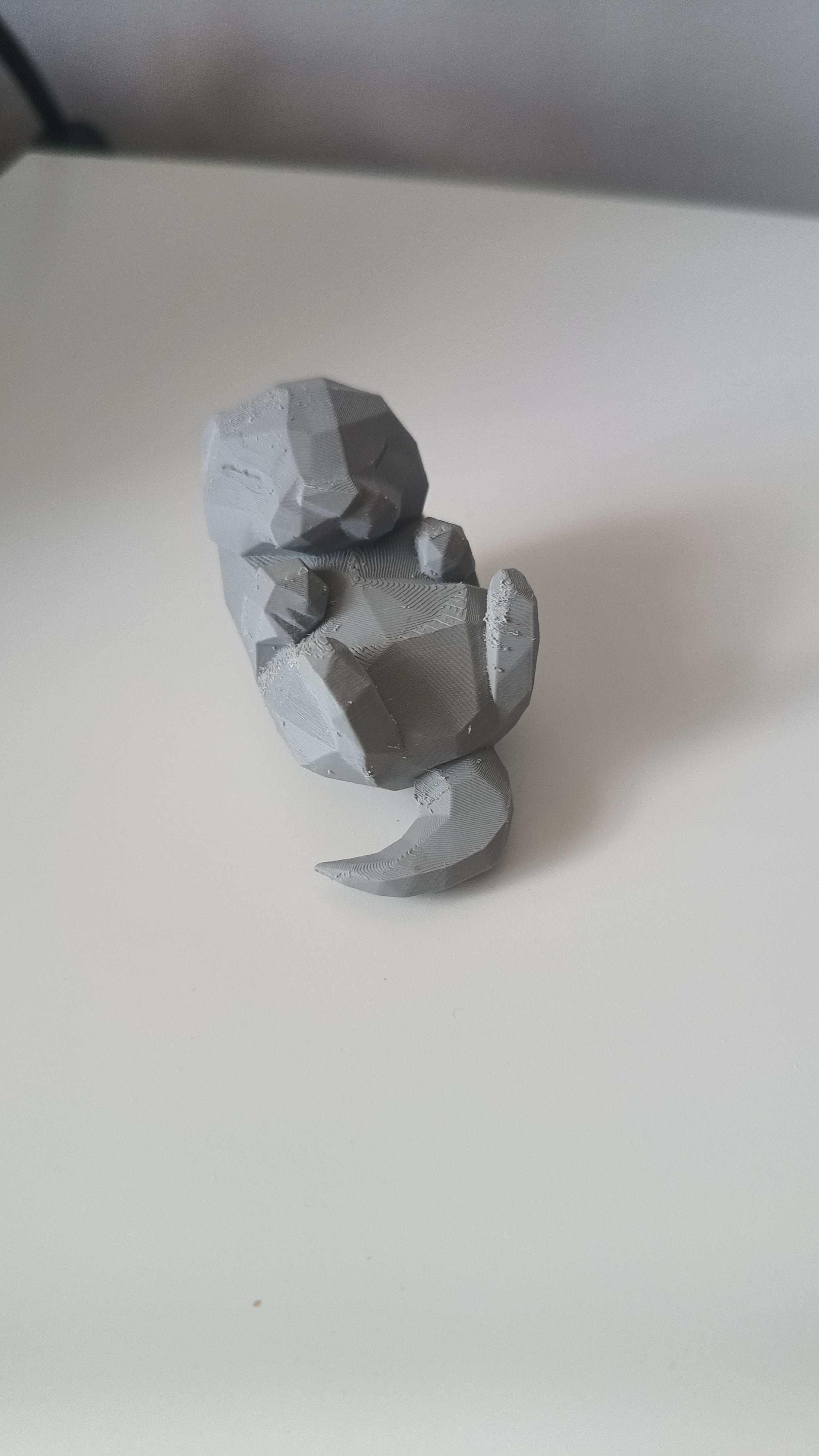 Low Poly Sleeping Otter Figurine