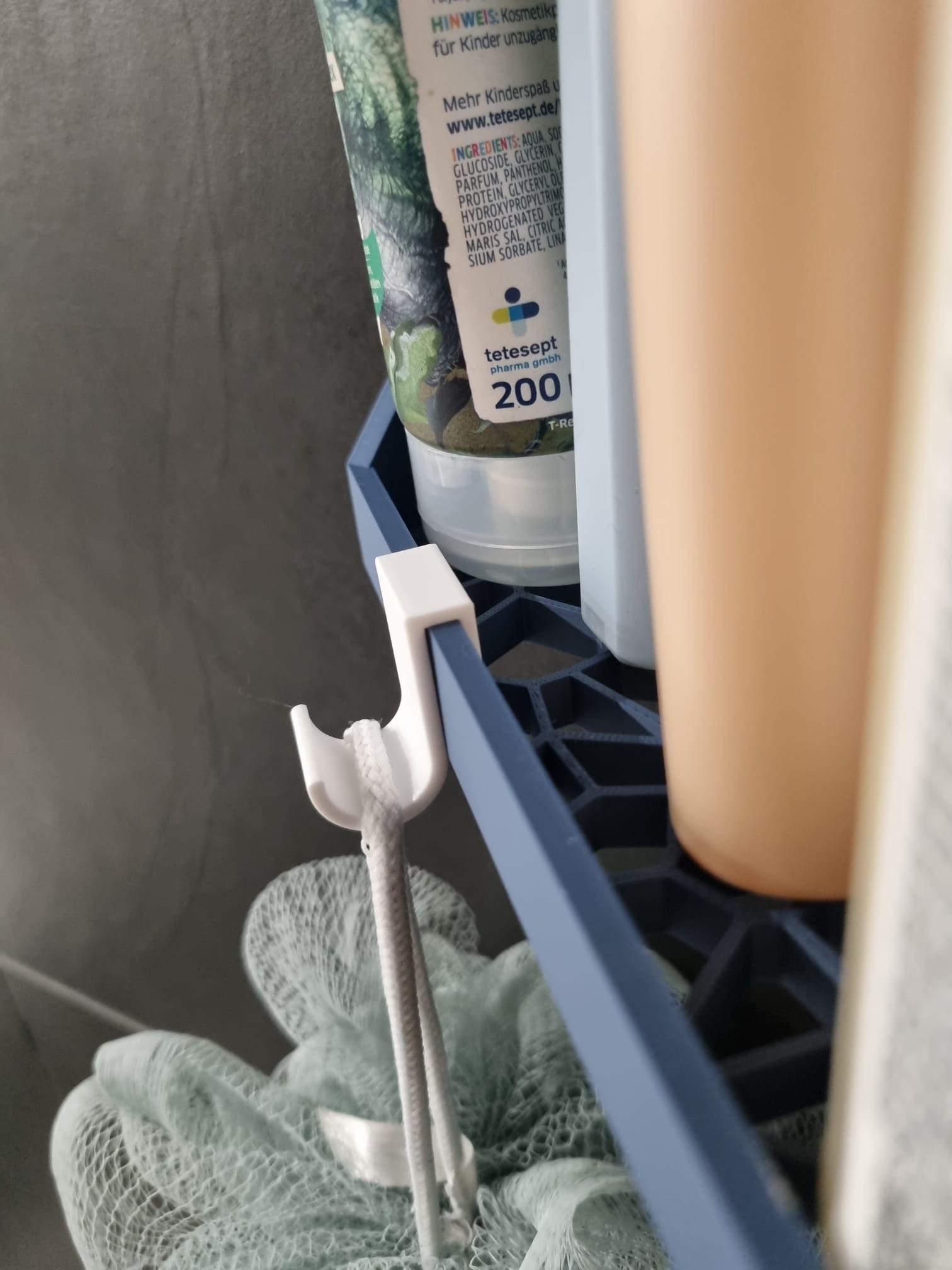 Simple hook for corner shower shelf
