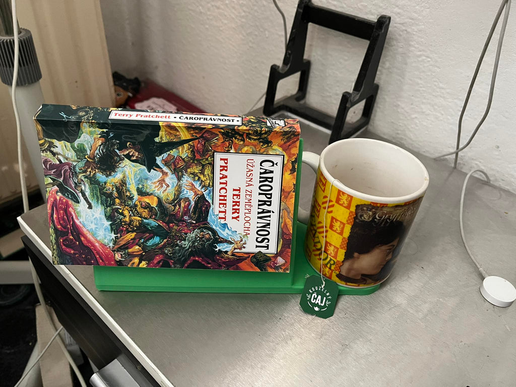 Holder for a read book and a mug of tea