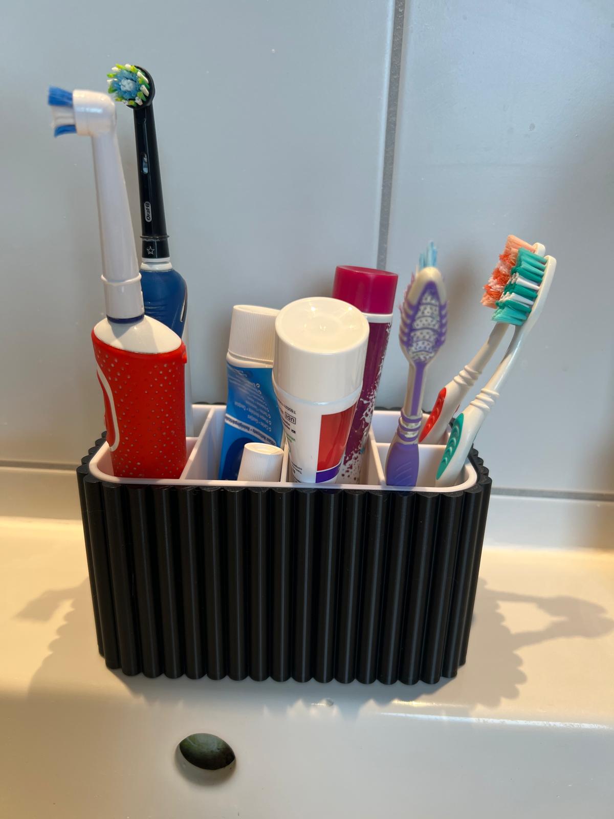 Bathroom toothbrush and toothpaste organiser