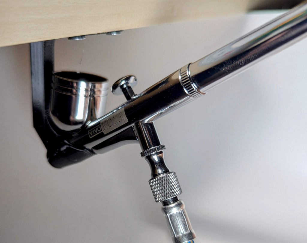 Under shelf airbrush holder