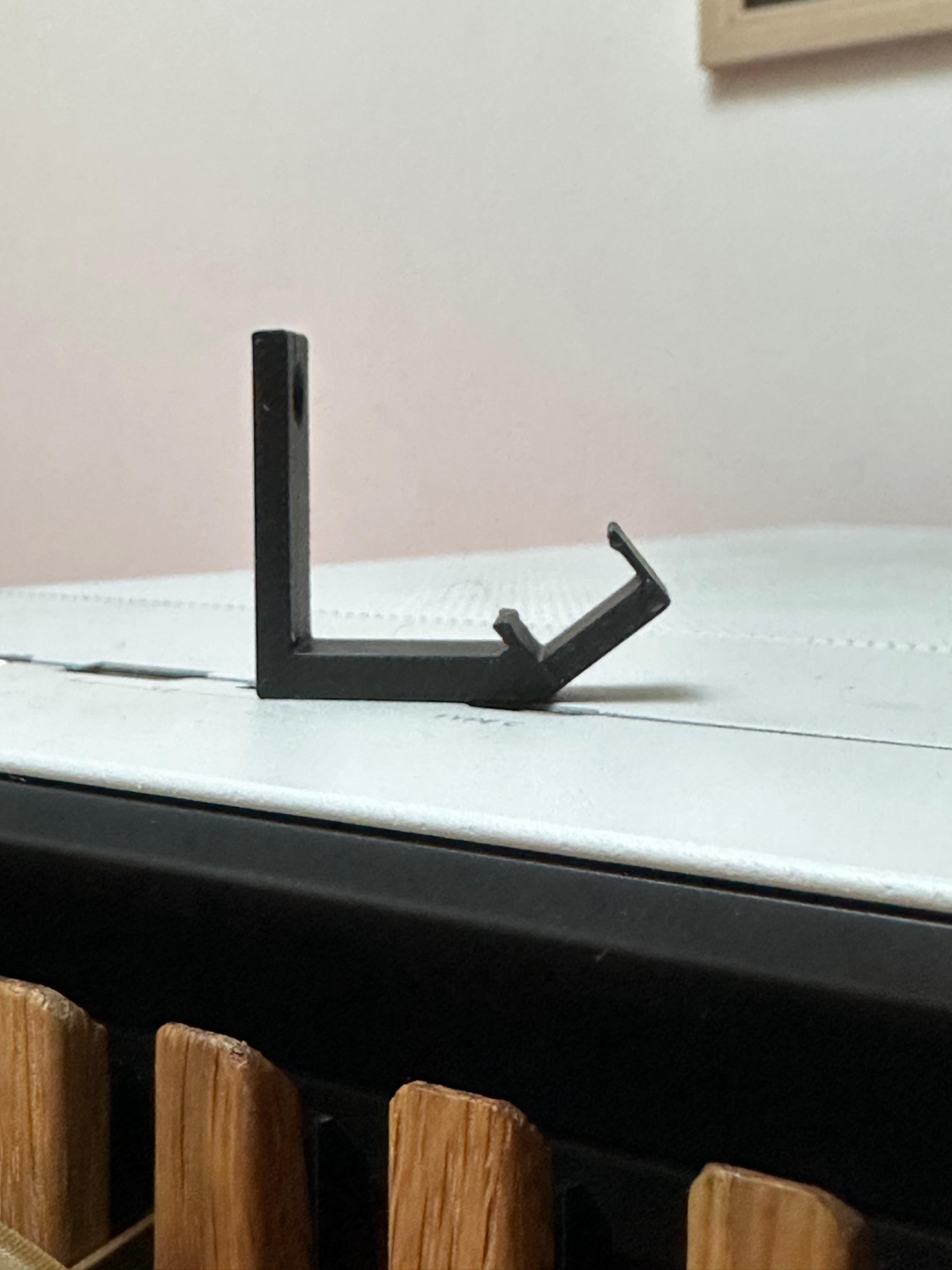 Back-facing angled LED strip hooks