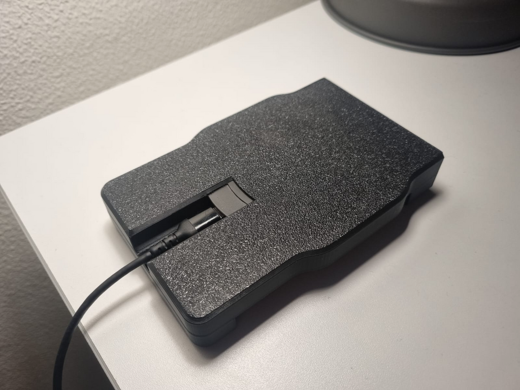 Phone holder with wireless charger inside