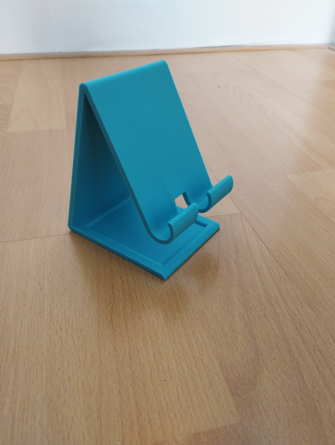 phone holder with charging cable hole