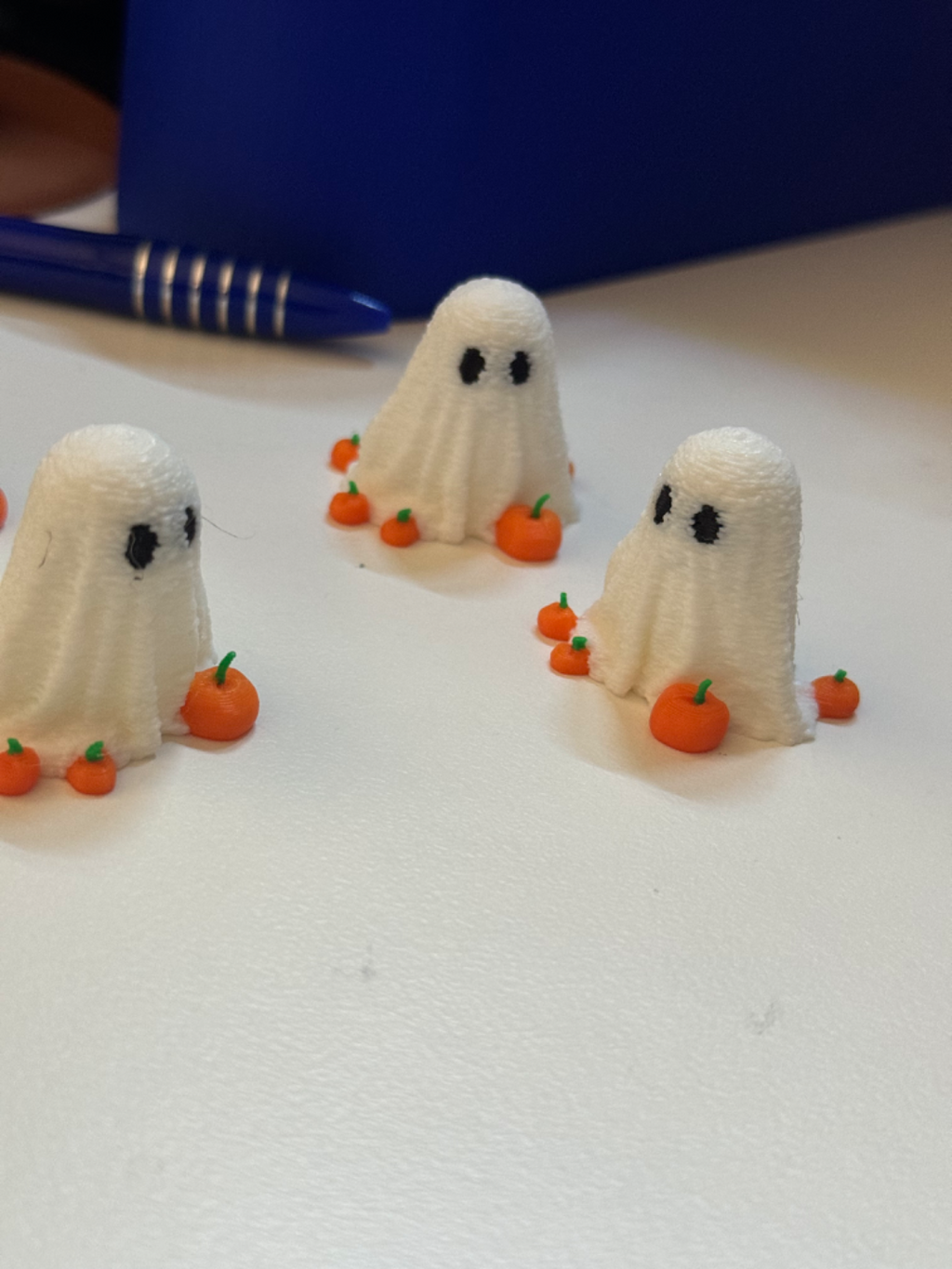 Mini Ghost for Halloween surrounded by pumpkins
