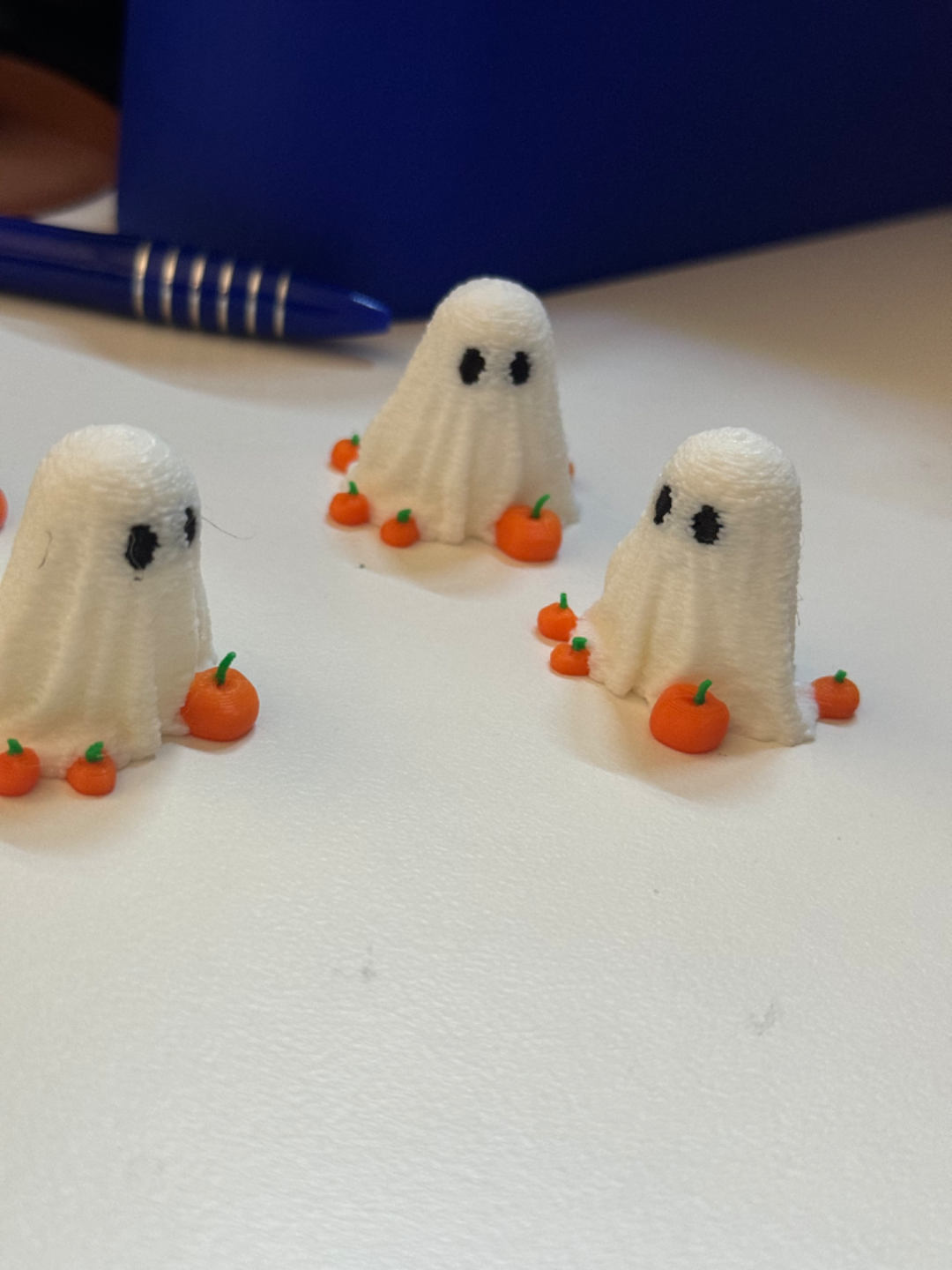 Mini Ghost for Halloween surrounded by pumpkins