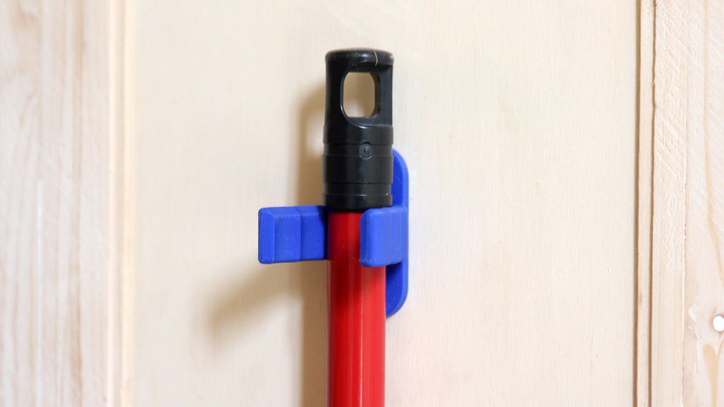 Universal hook for brooms and vacuum cleaners
