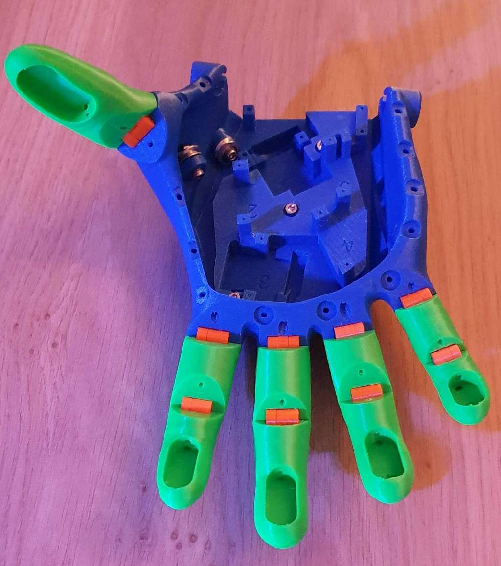 Voice activated low cost motorized hand