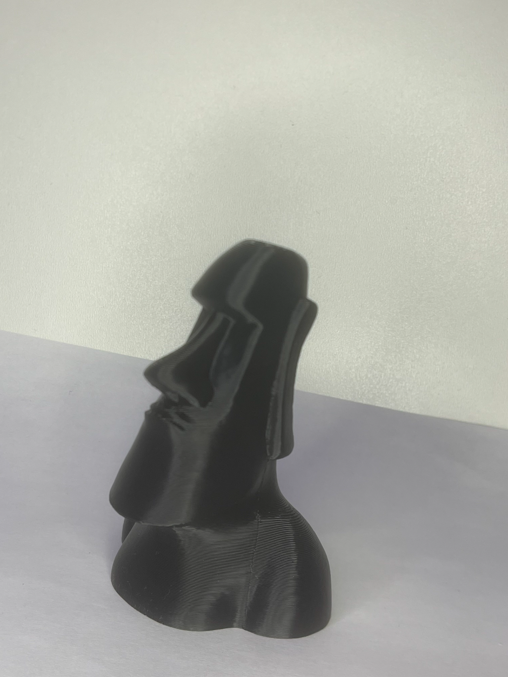 moai stone statue and a rose