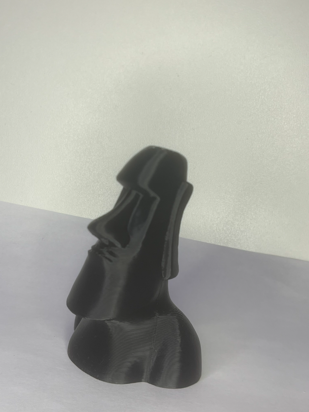moai stone statue and a rose
