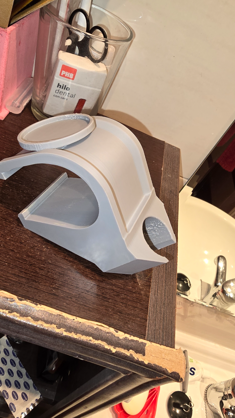 Shower head bracket and tea candle holder