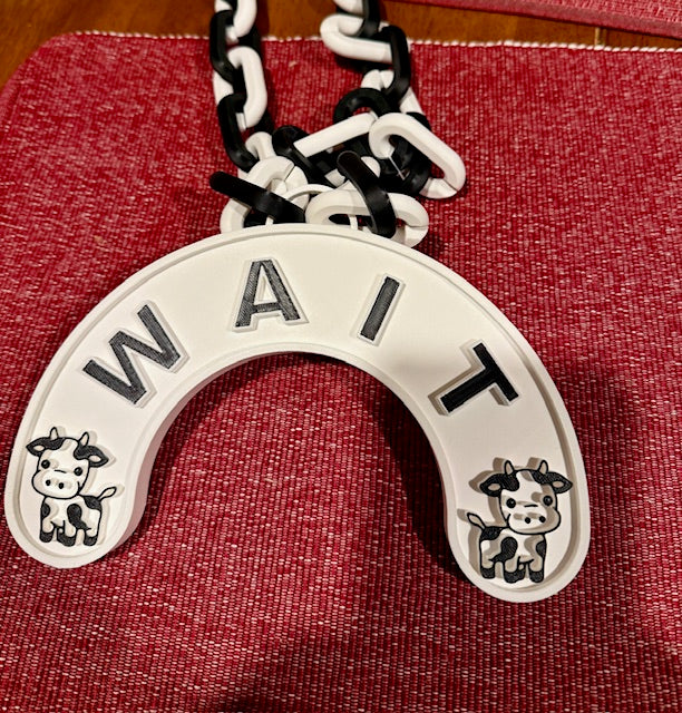 A necklace with a cute Cow that makes no sense