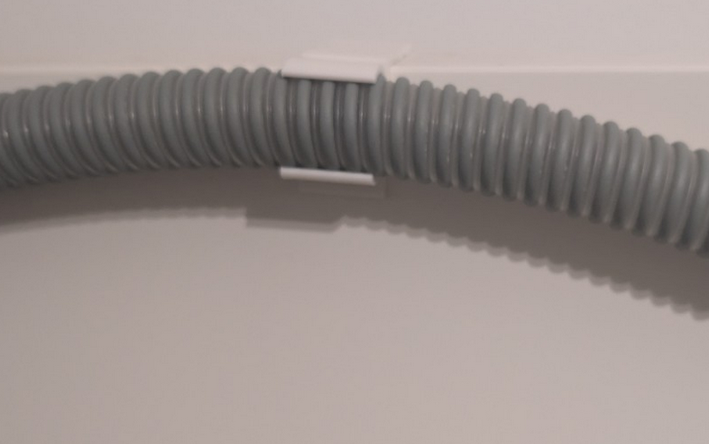 Parametric cpap tube holder for bed headboards