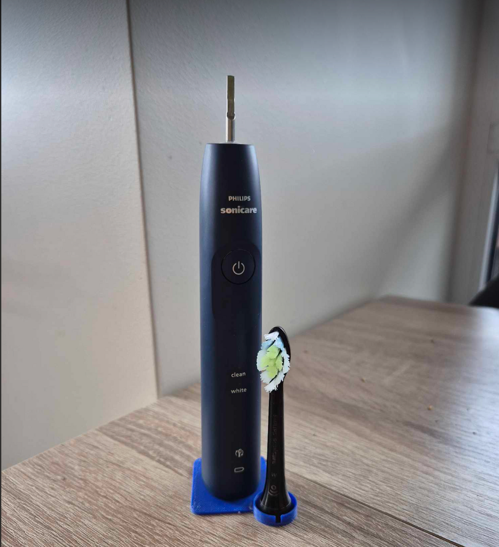 Philips SoniCare toothbrush and it's head stand