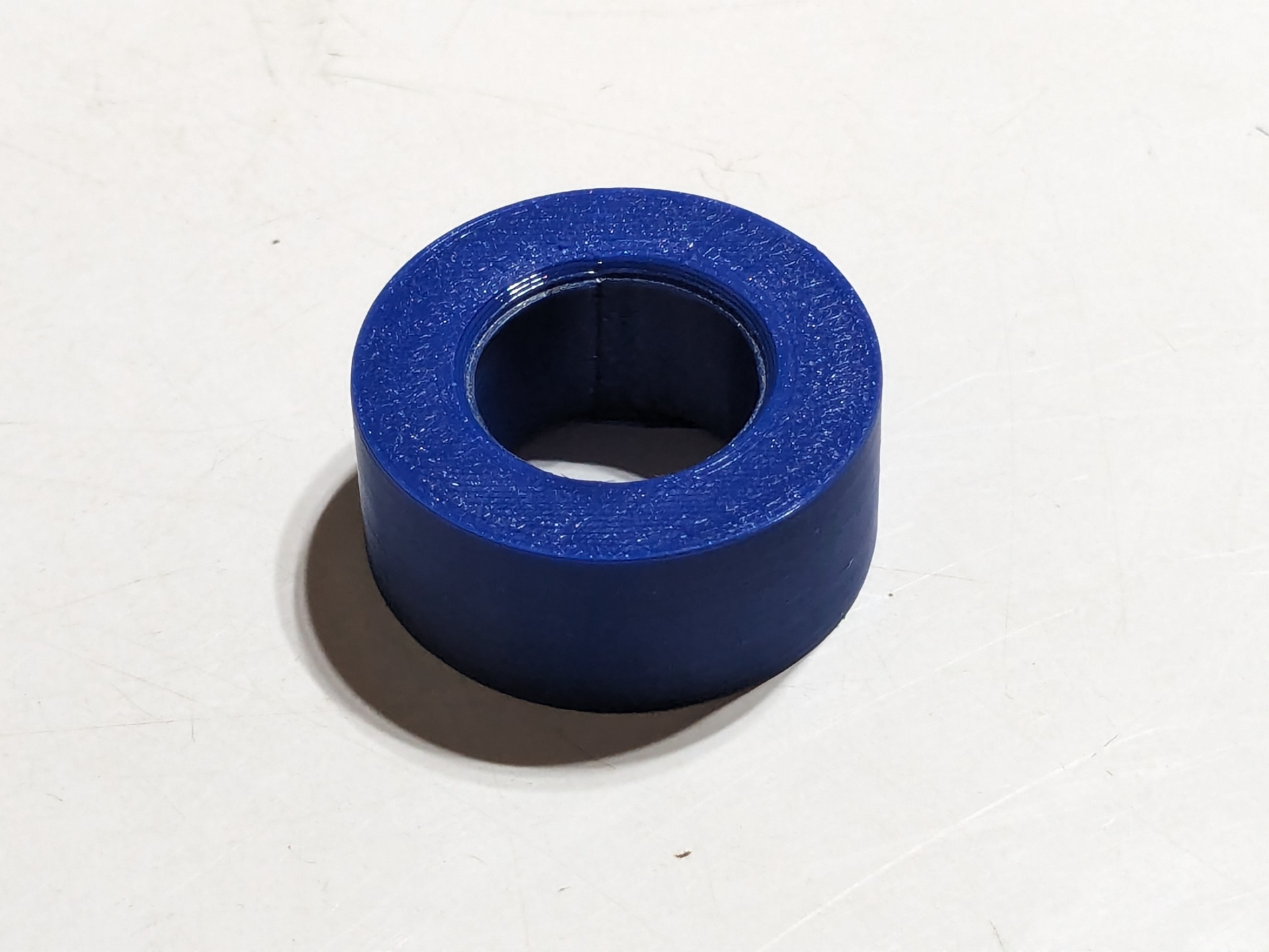 Bench grinder spacer