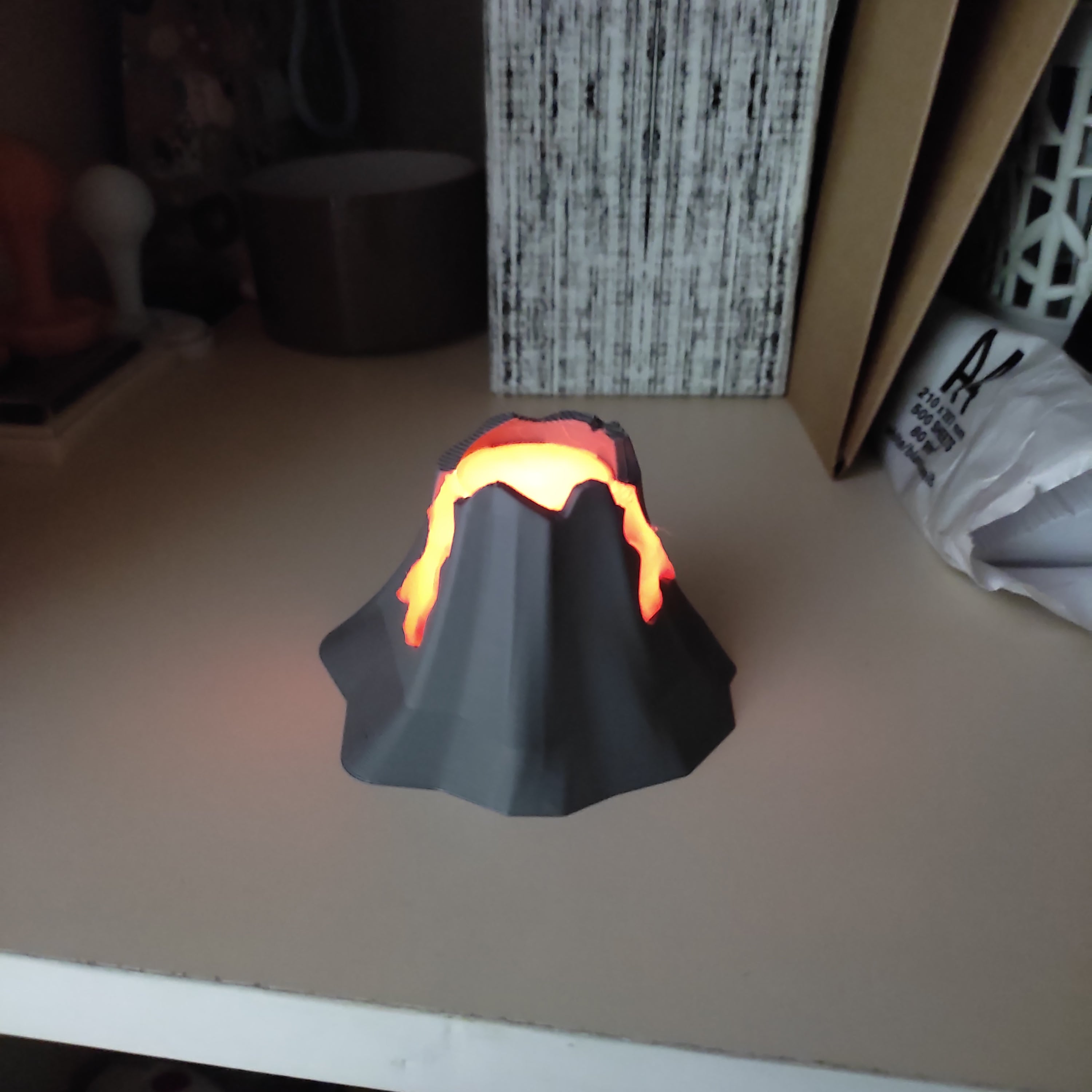 Erupting volcano diorama with glowing lava
