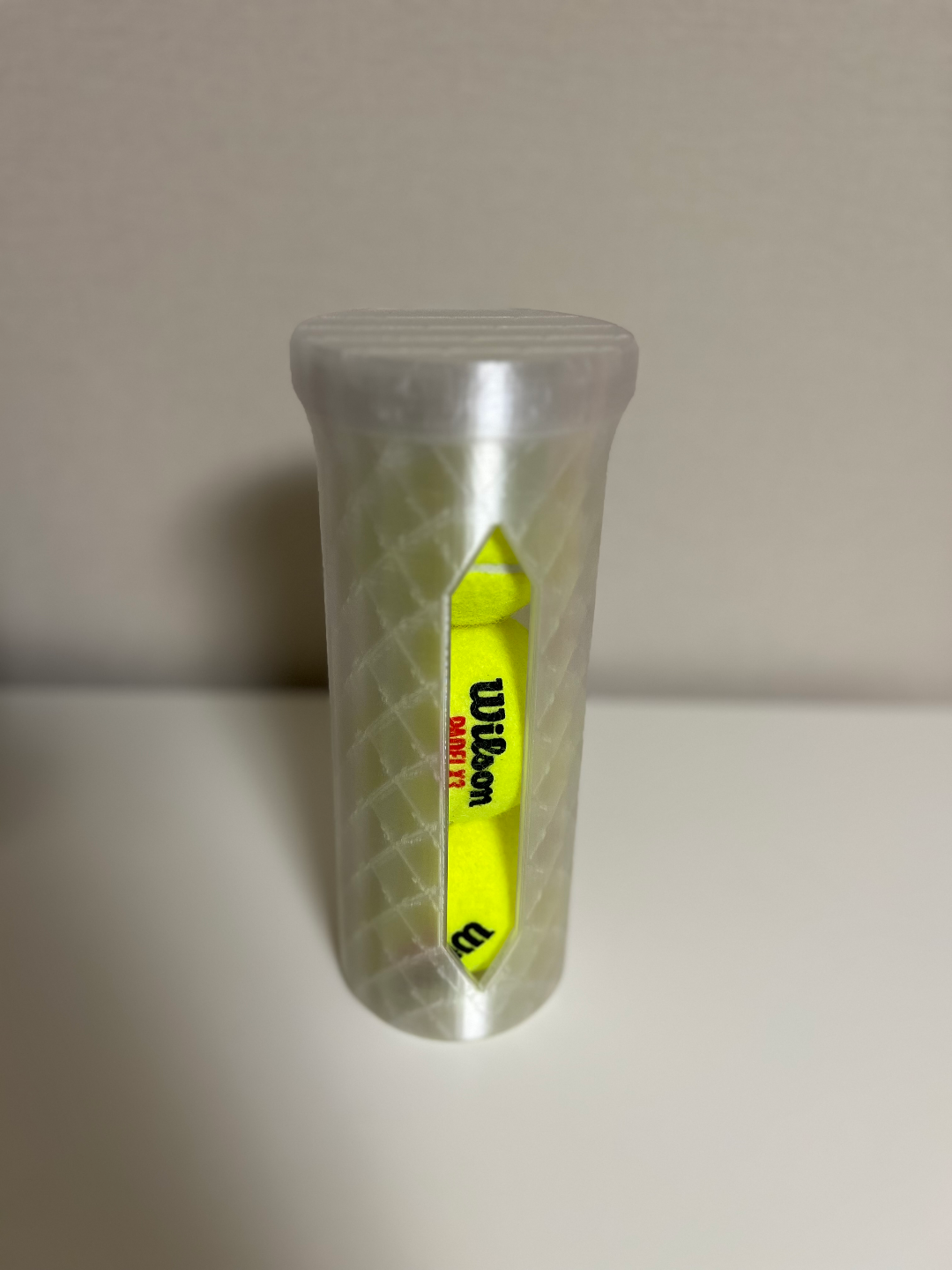 Storage box for tennis balls