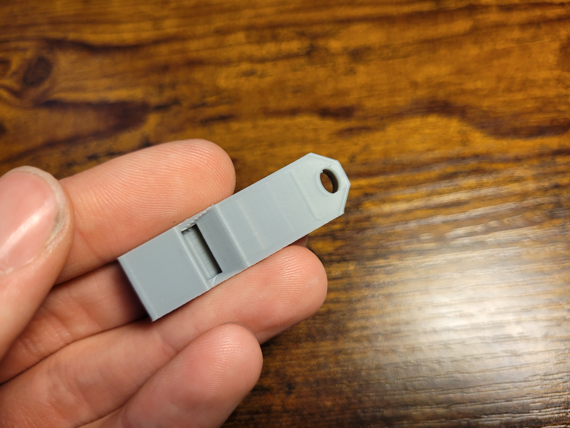 Simple, very loud keychain whistle