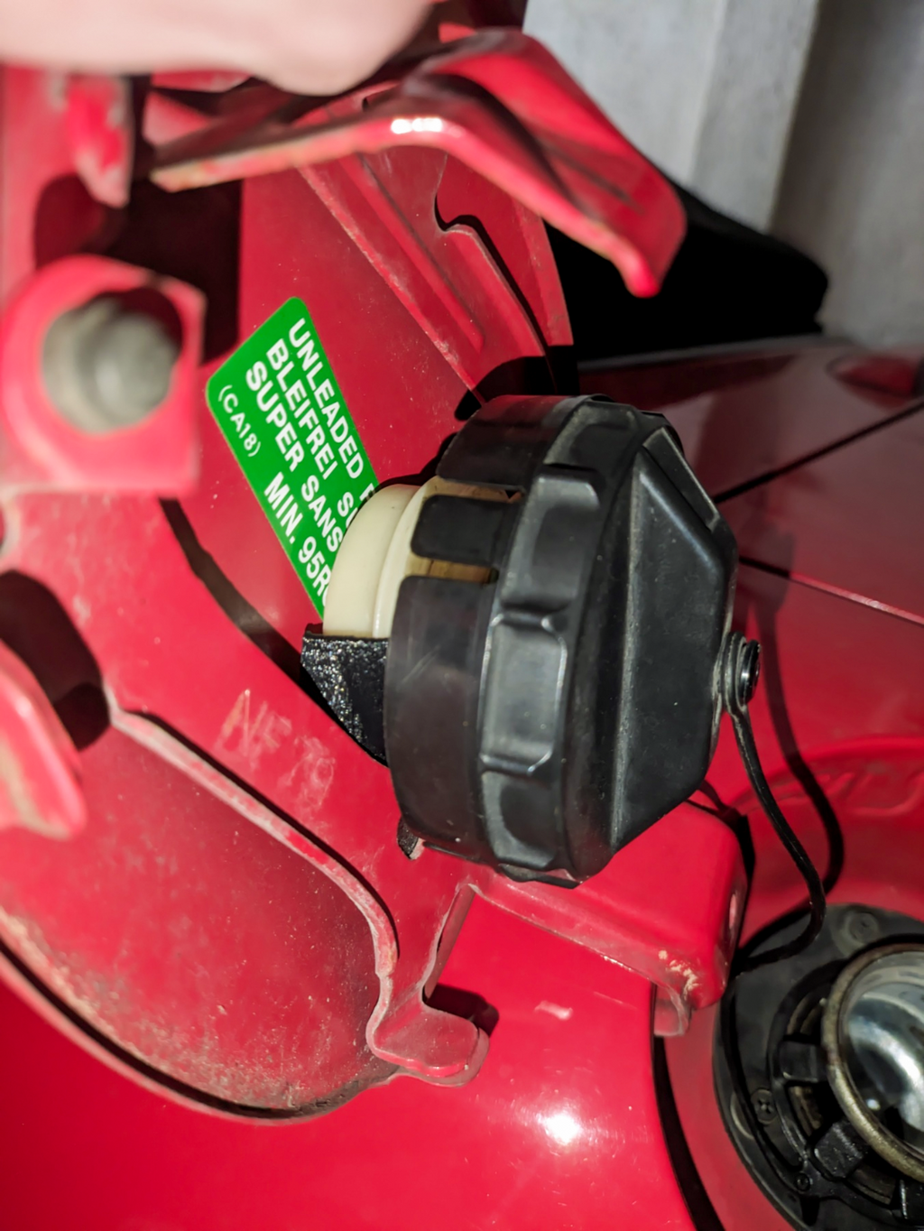 Mazda MX-5 NC gas cap holder with snap fit