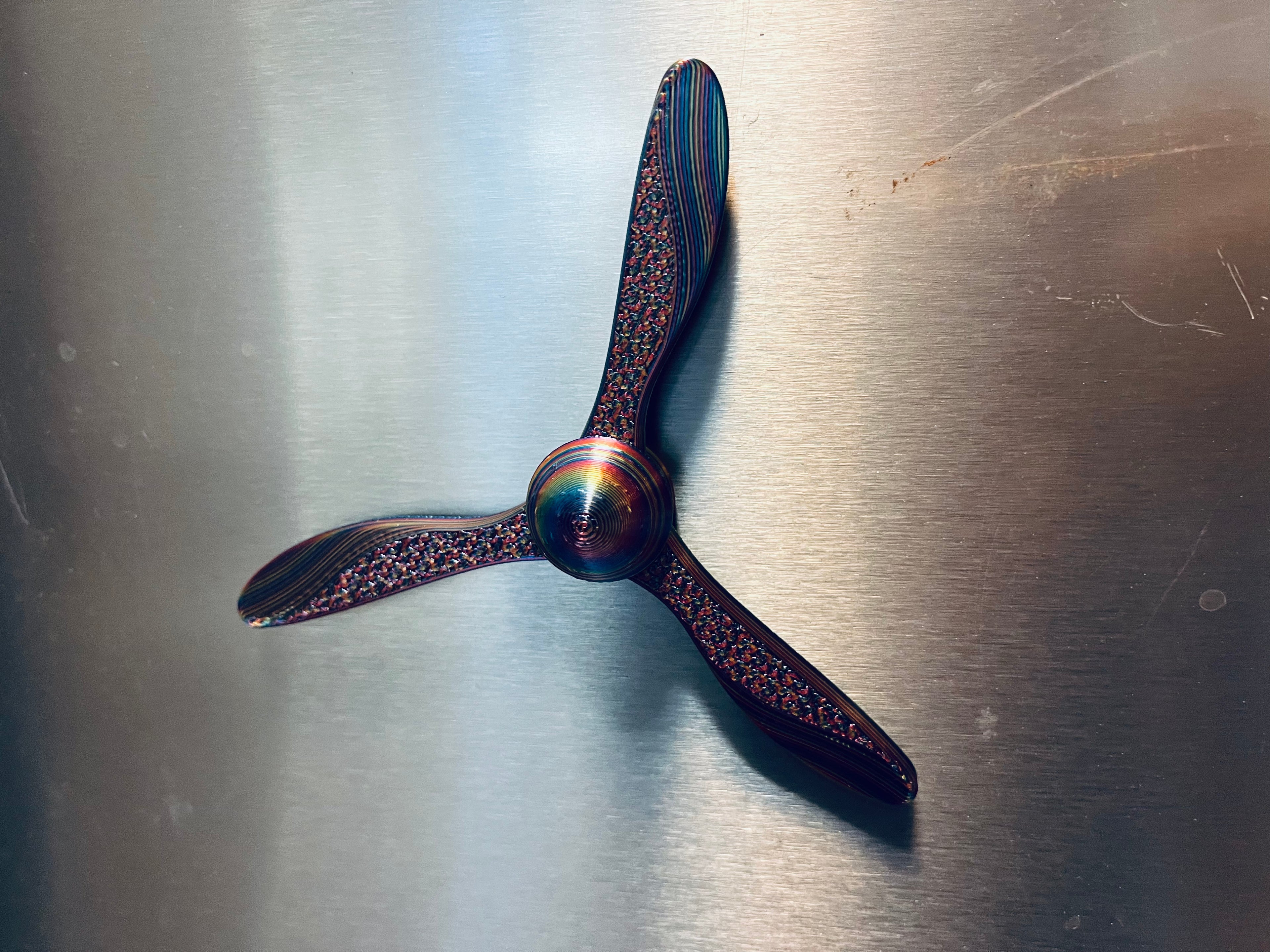 Spinning airplane propeller fridge magnet