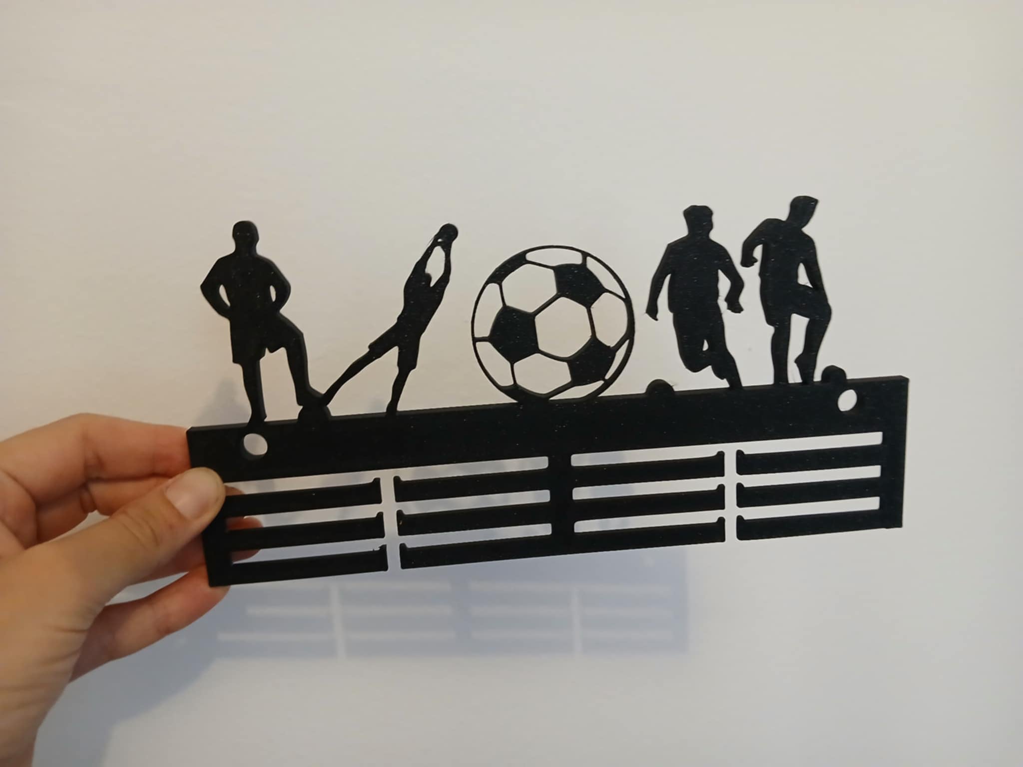 Medal holder for a football player