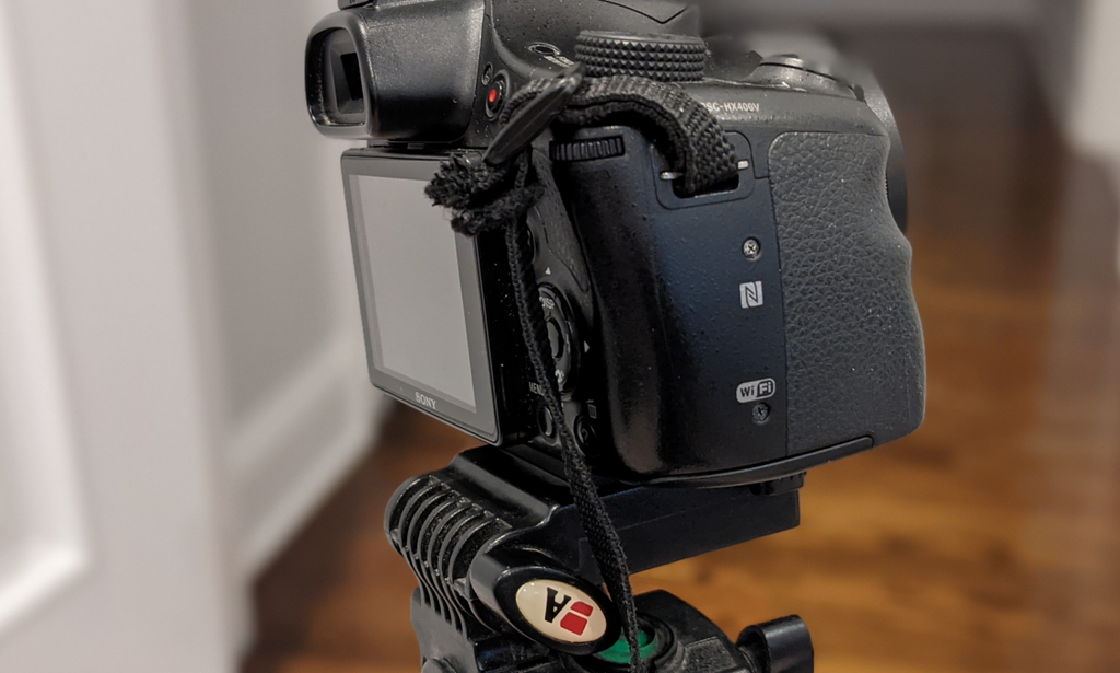 Cam locking camera mount for quick release tripod