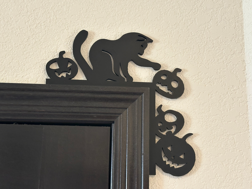 Cat Pushing Pumpkins Door Corner