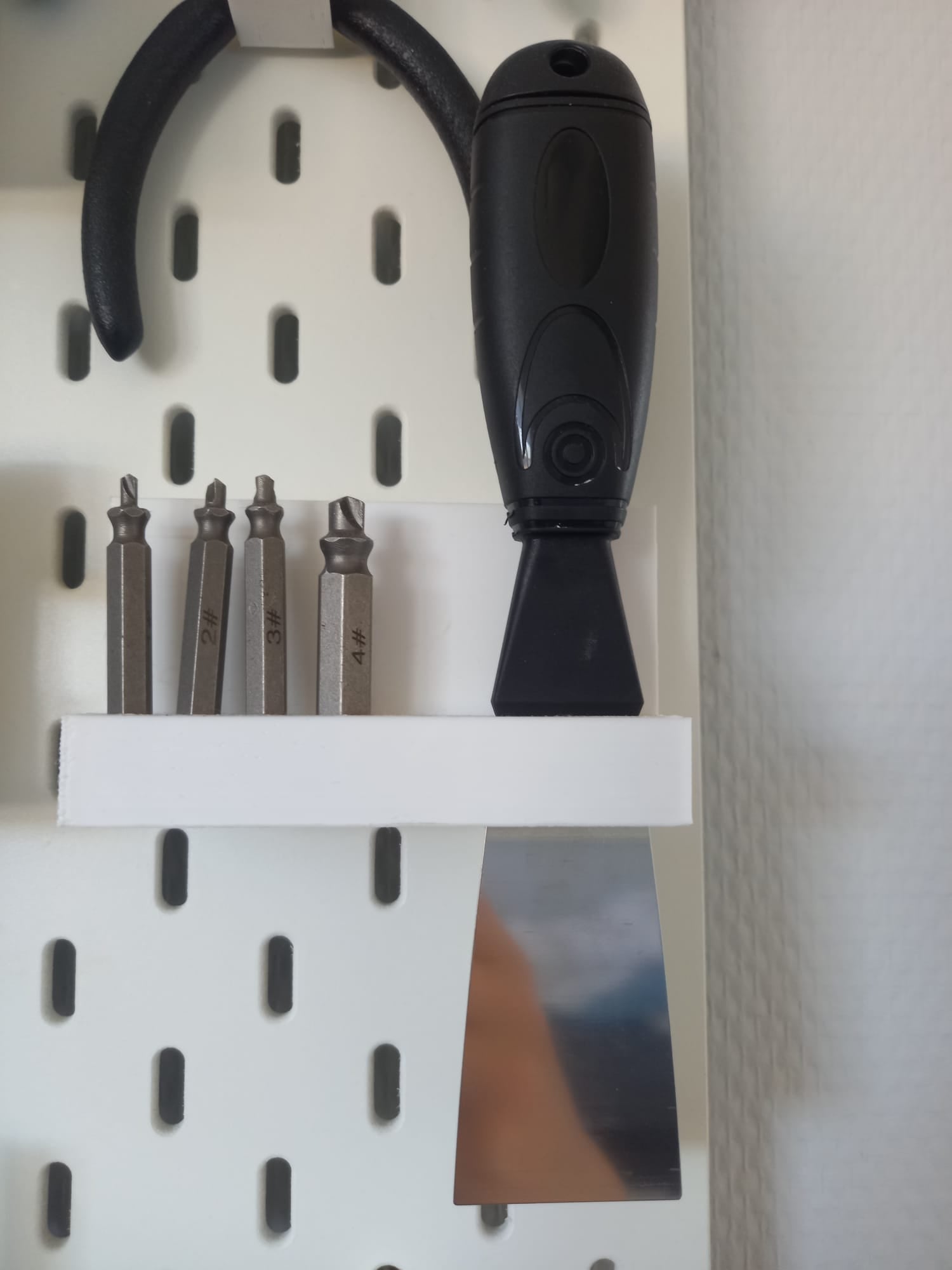 scraper and bit holder pegboard