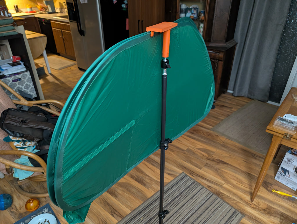 Tripod mounted green screen holder clip