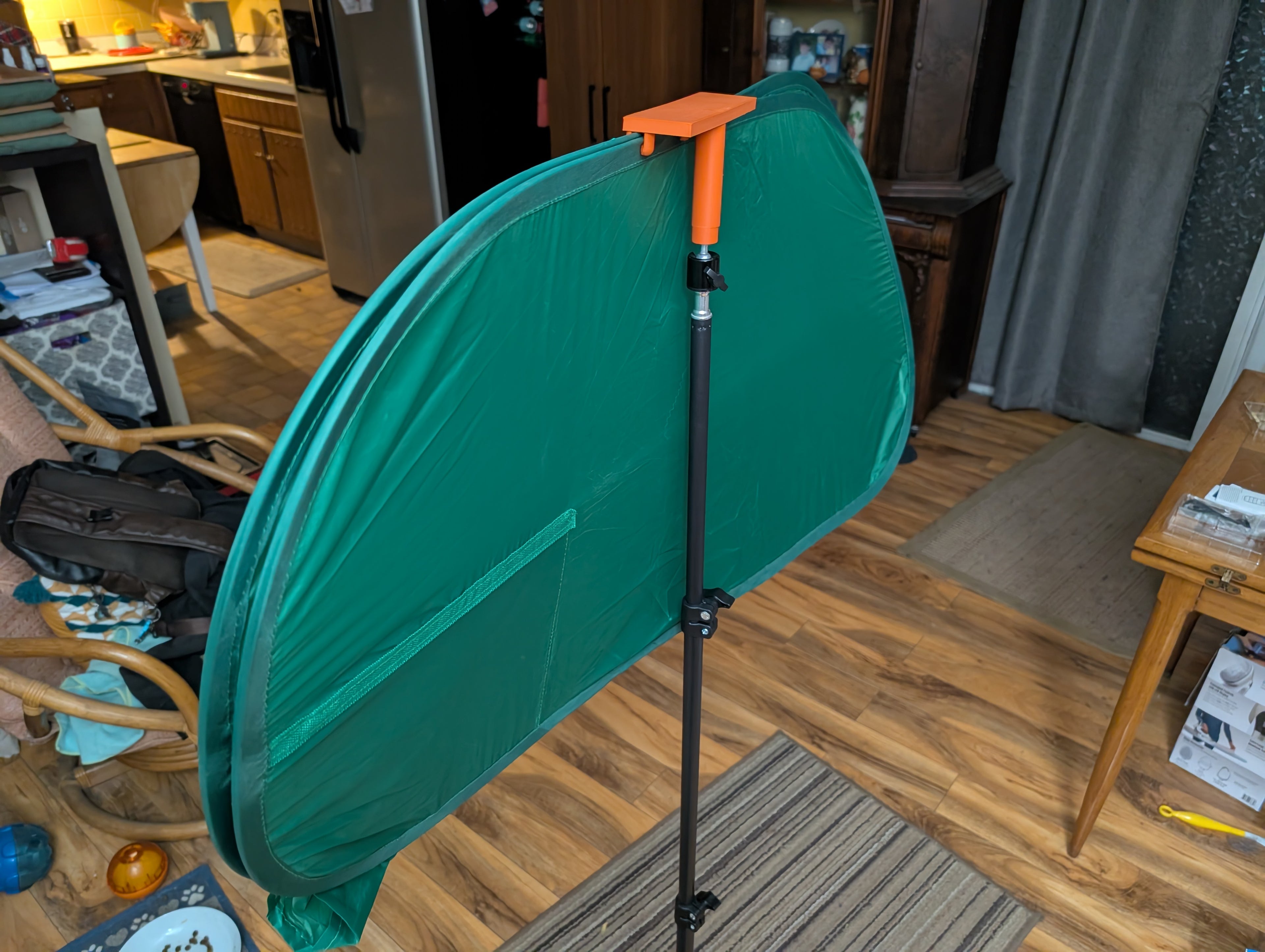 Tripod mounted green screen holder clip