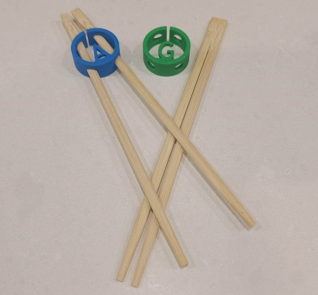 Chopstick gripper / holder with optional letter