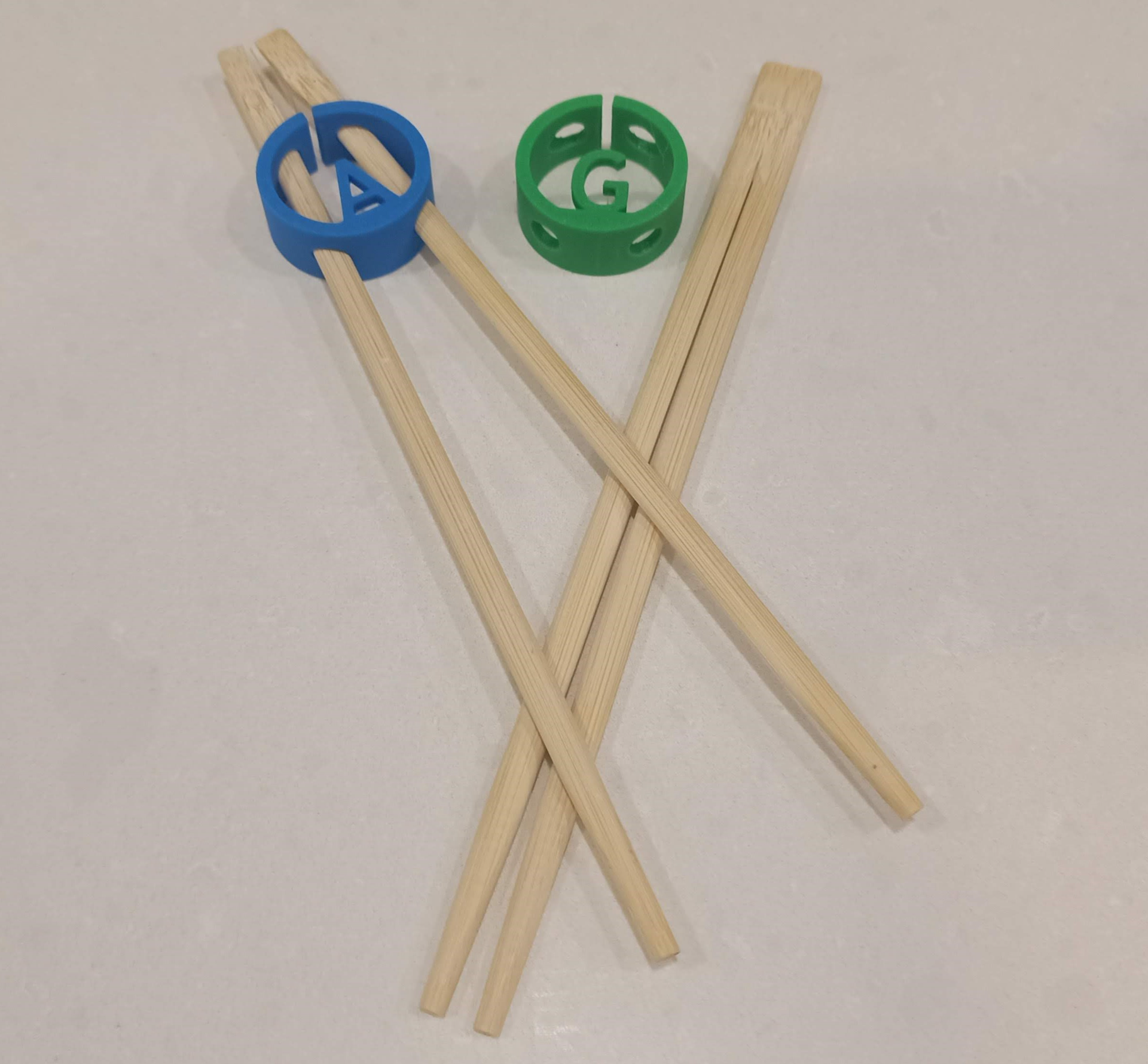 Chopstick gripper / holder with optional letter