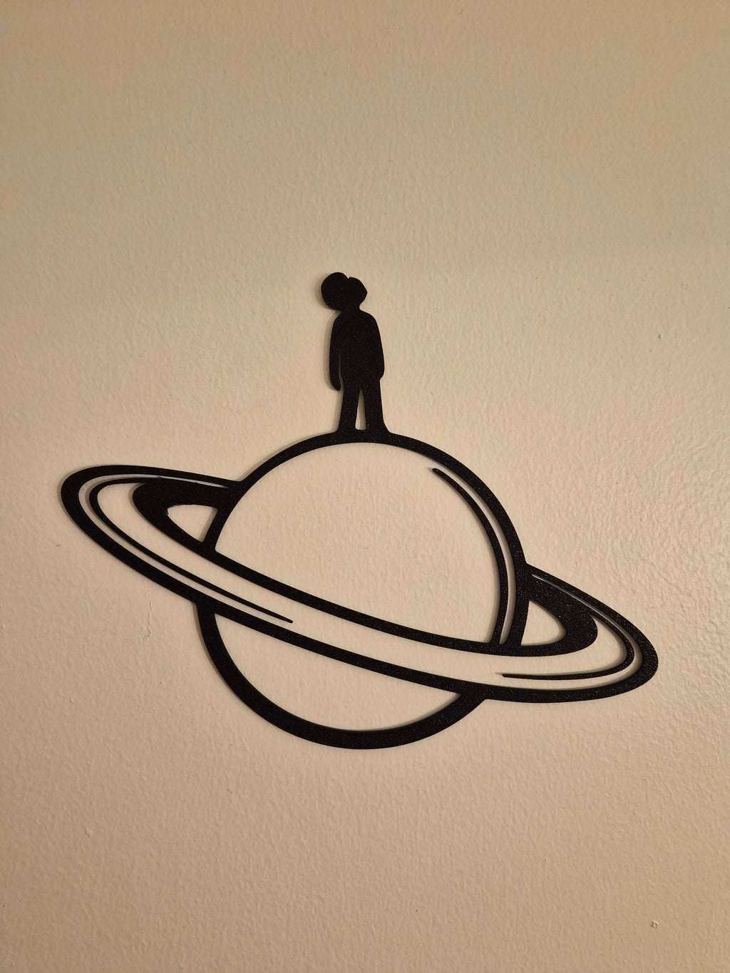 Man on Saturn Wall Art
