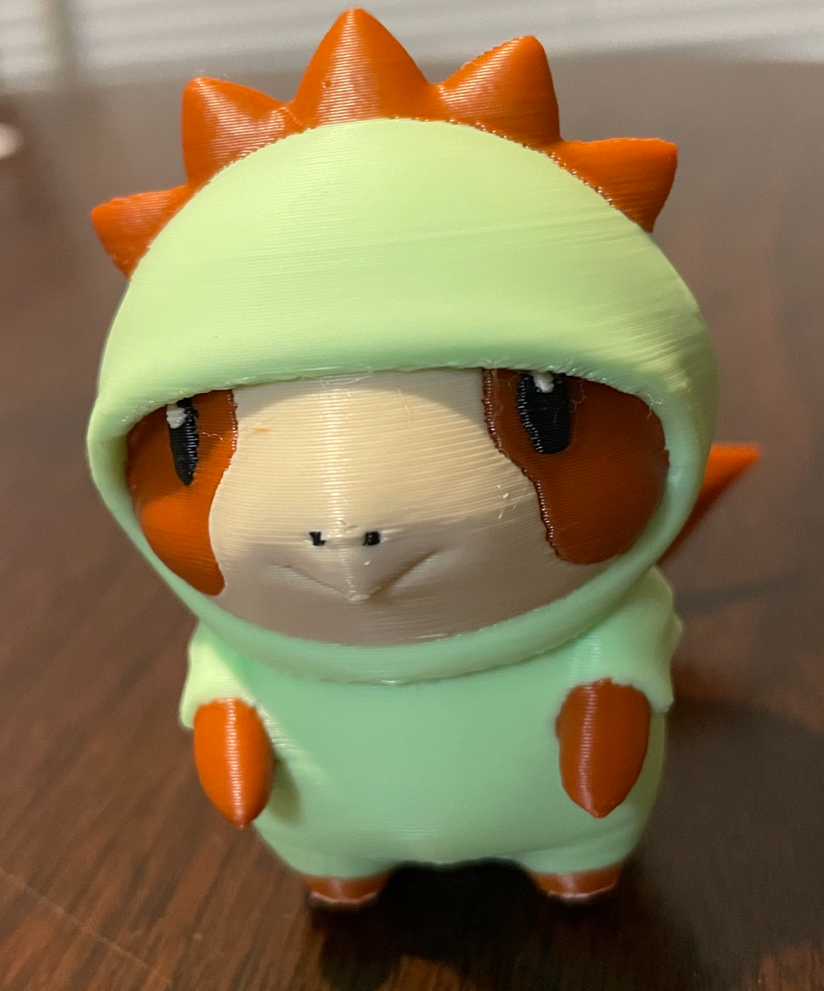 Guinea pig in a dragon onesie