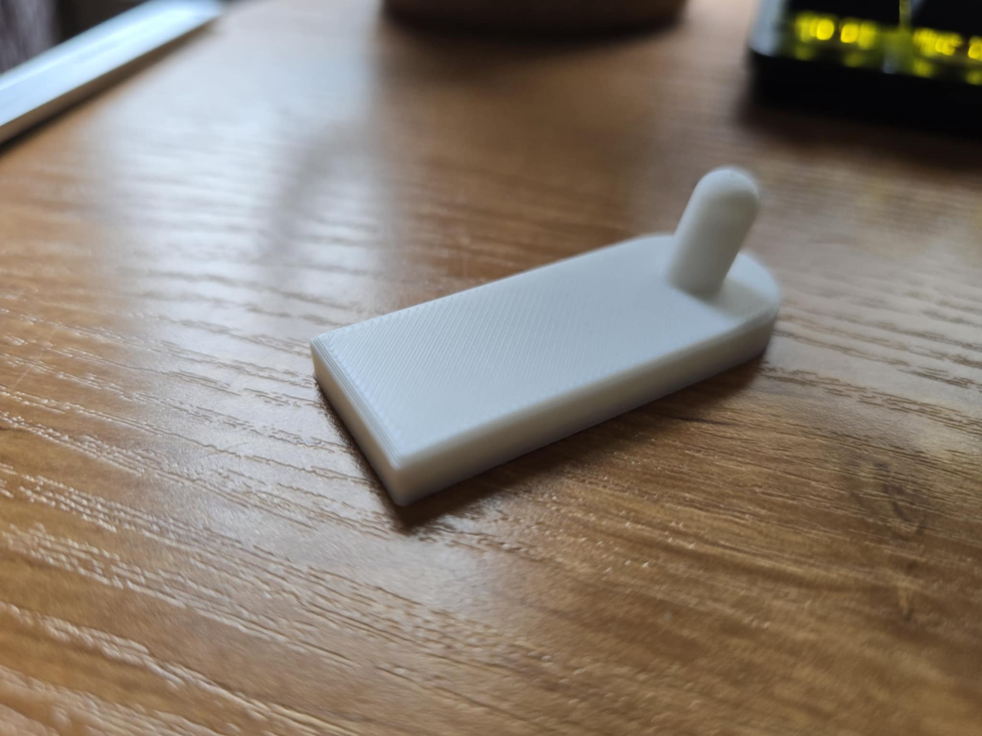 Flush wall hook using adhesive
