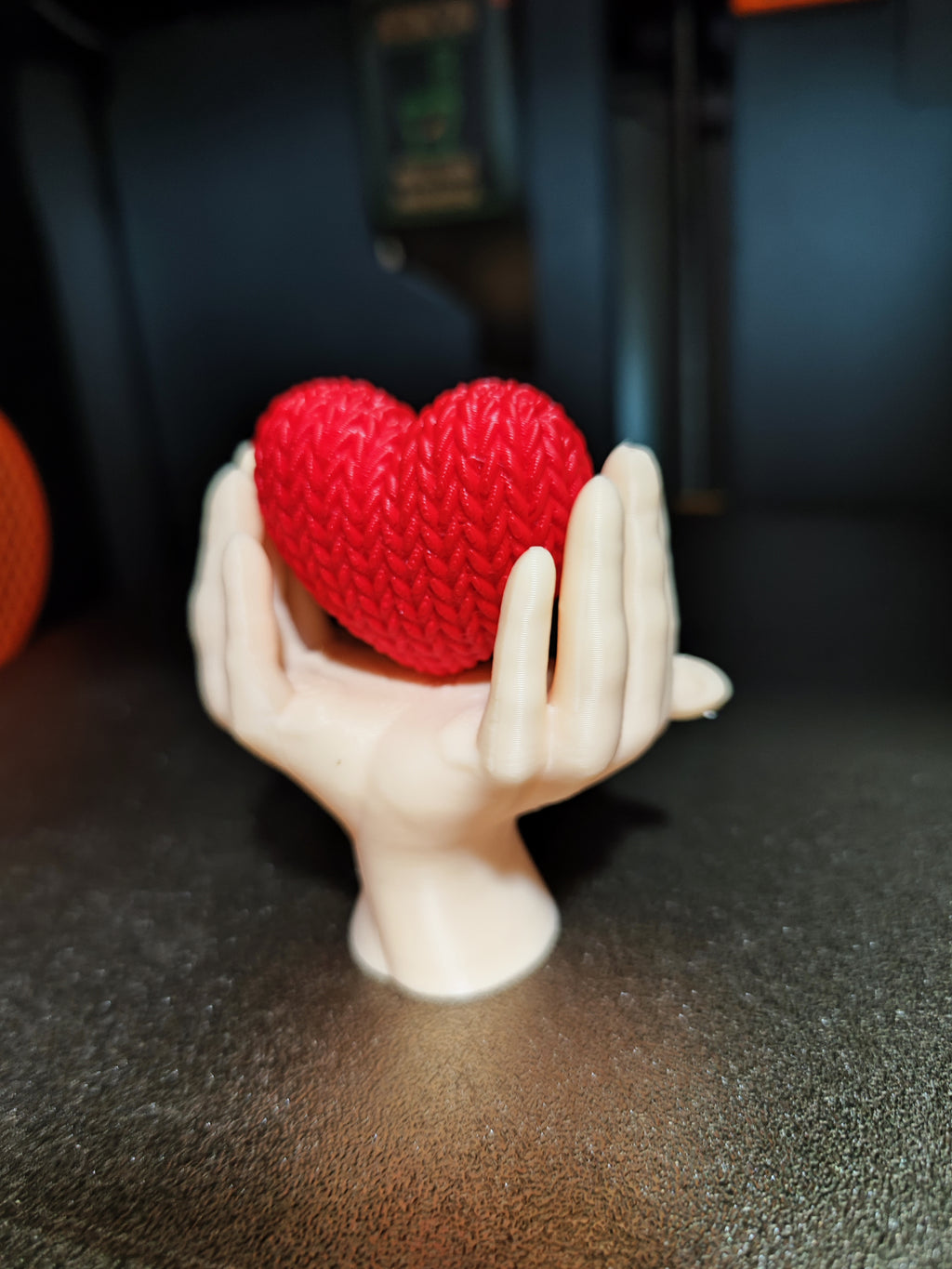 Heart knitted in hands