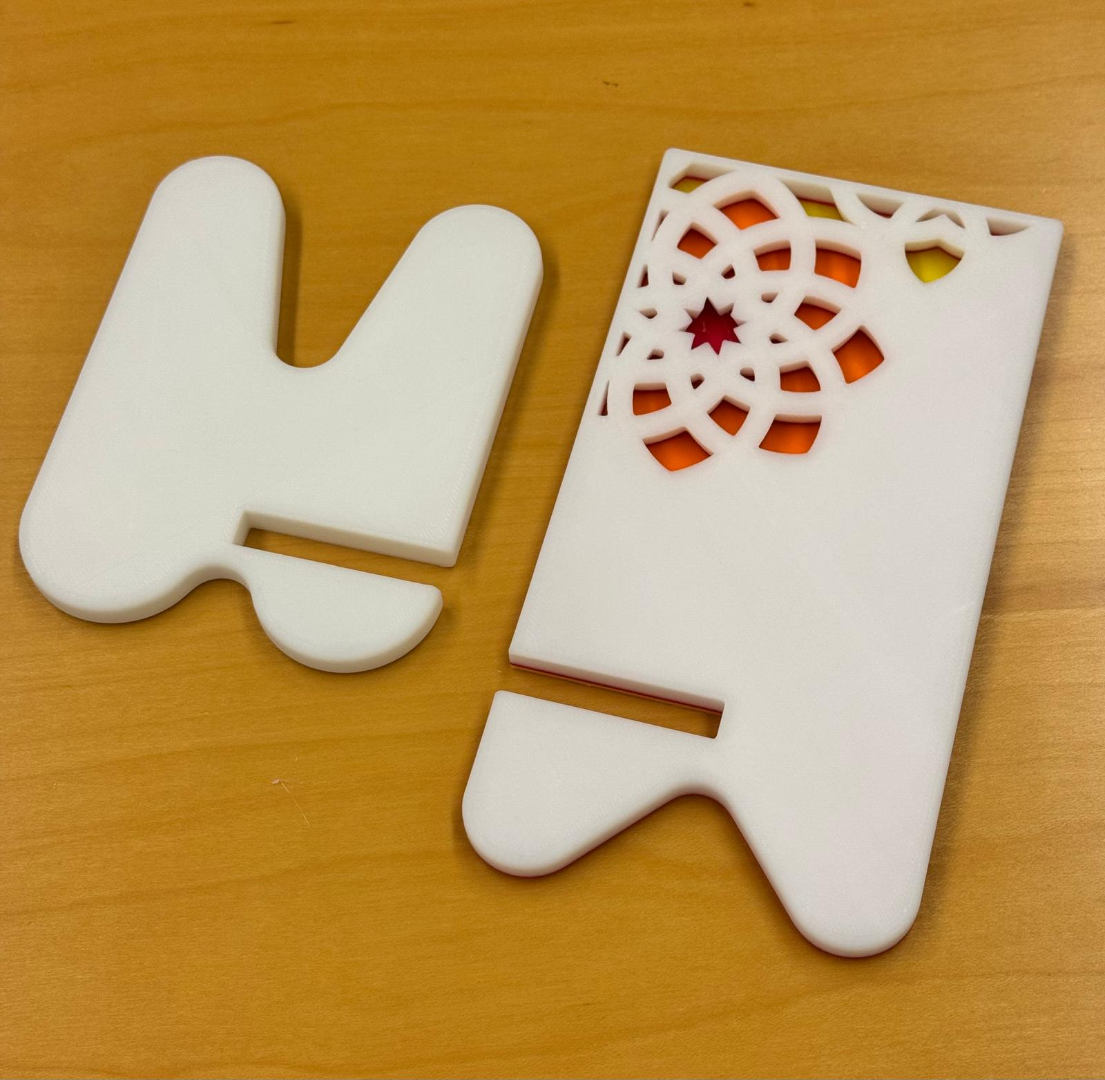 Elegant phone stand with engraved design pattern